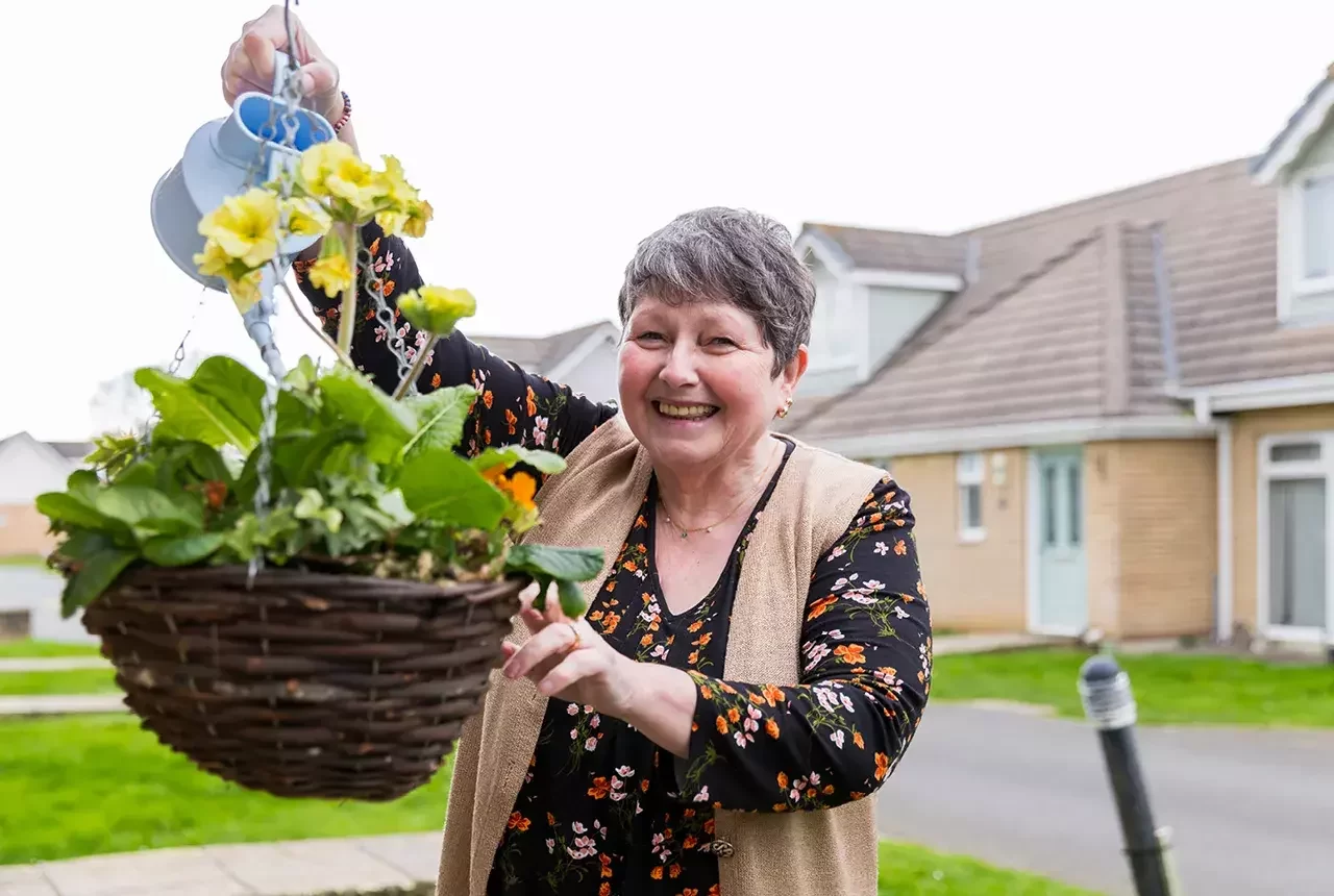 Watering the garden in her new Home