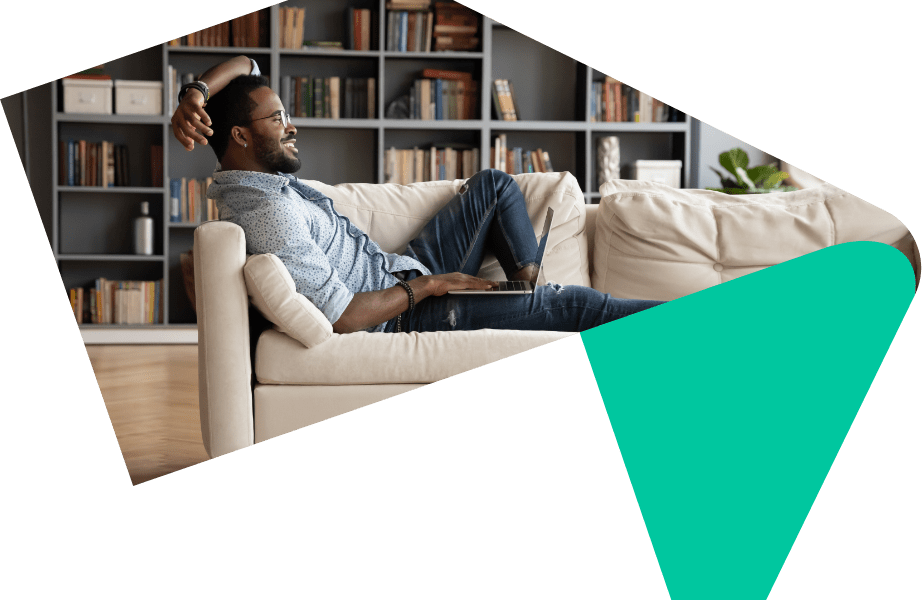 Man relaxing at home on the sofa applying to use Your Home