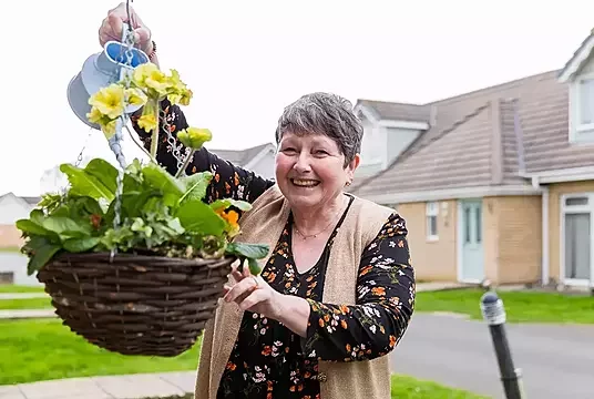 Watering the garden in her new Home